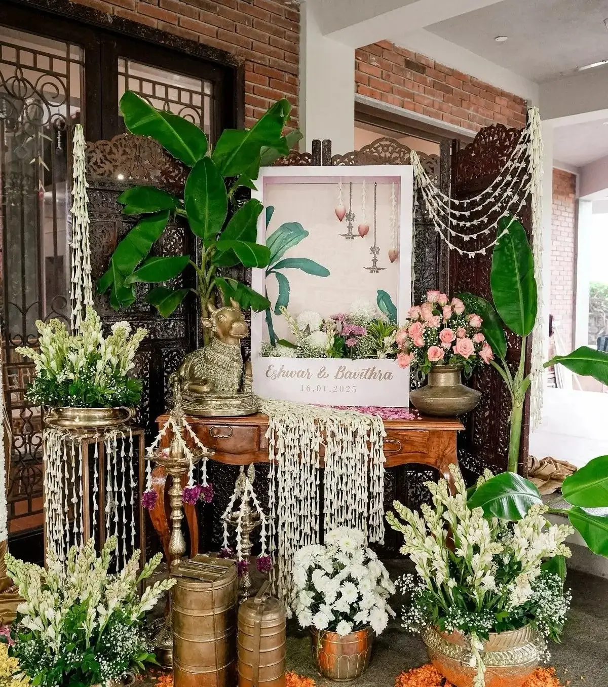 Kalinga Events - Elegant floral entrance setup with black frames and cascading white flowers, Odisha