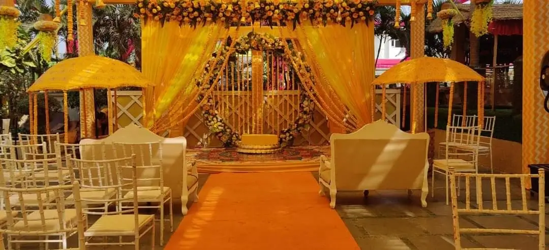 Kalinga Events - Traditional Odia wedding mandap with golden umbrellas and marigolds, Sambalpur