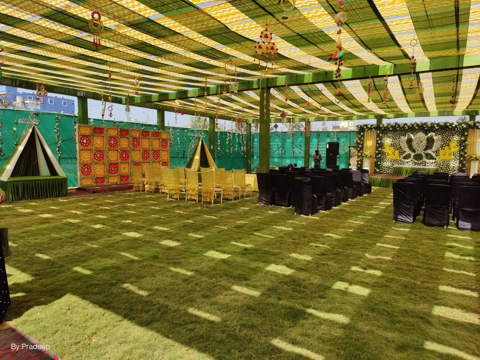 Kalinga Events - Grand indoor wedding reception with green draping and marigold garlands, Odisha